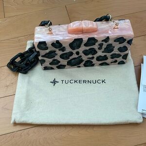 Never been used Tuckernuck “blush wild side leopard clutch”